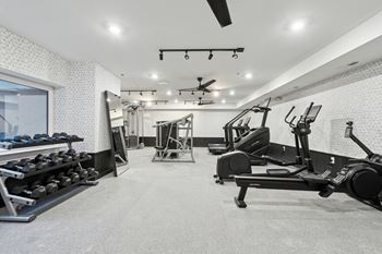 A spacious gym with a variety of equipment
